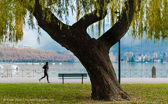 Jogger in lakeside park in Annecy